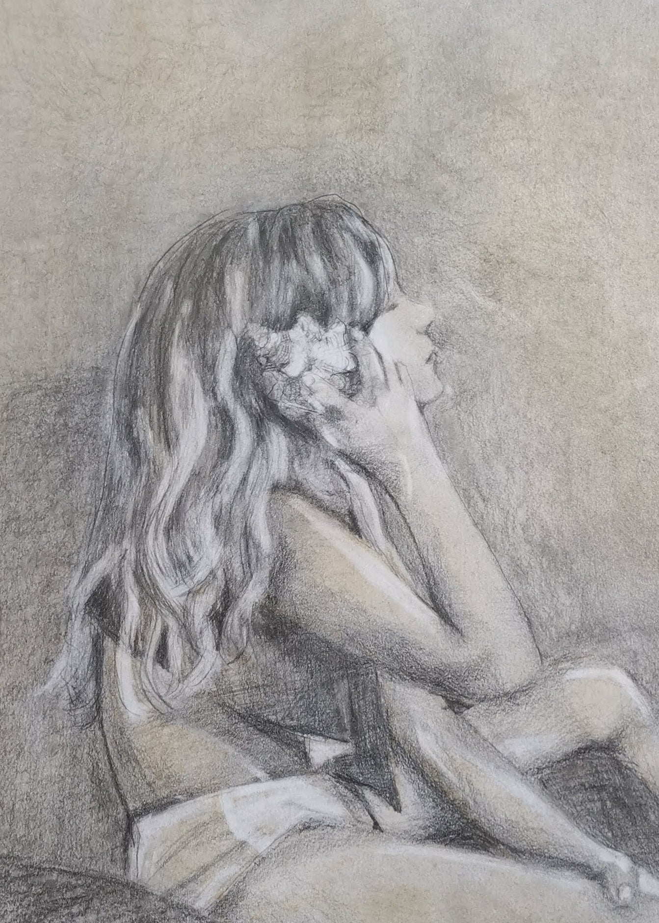 Pencil drawing of a person with long hair holding flowers to their face.